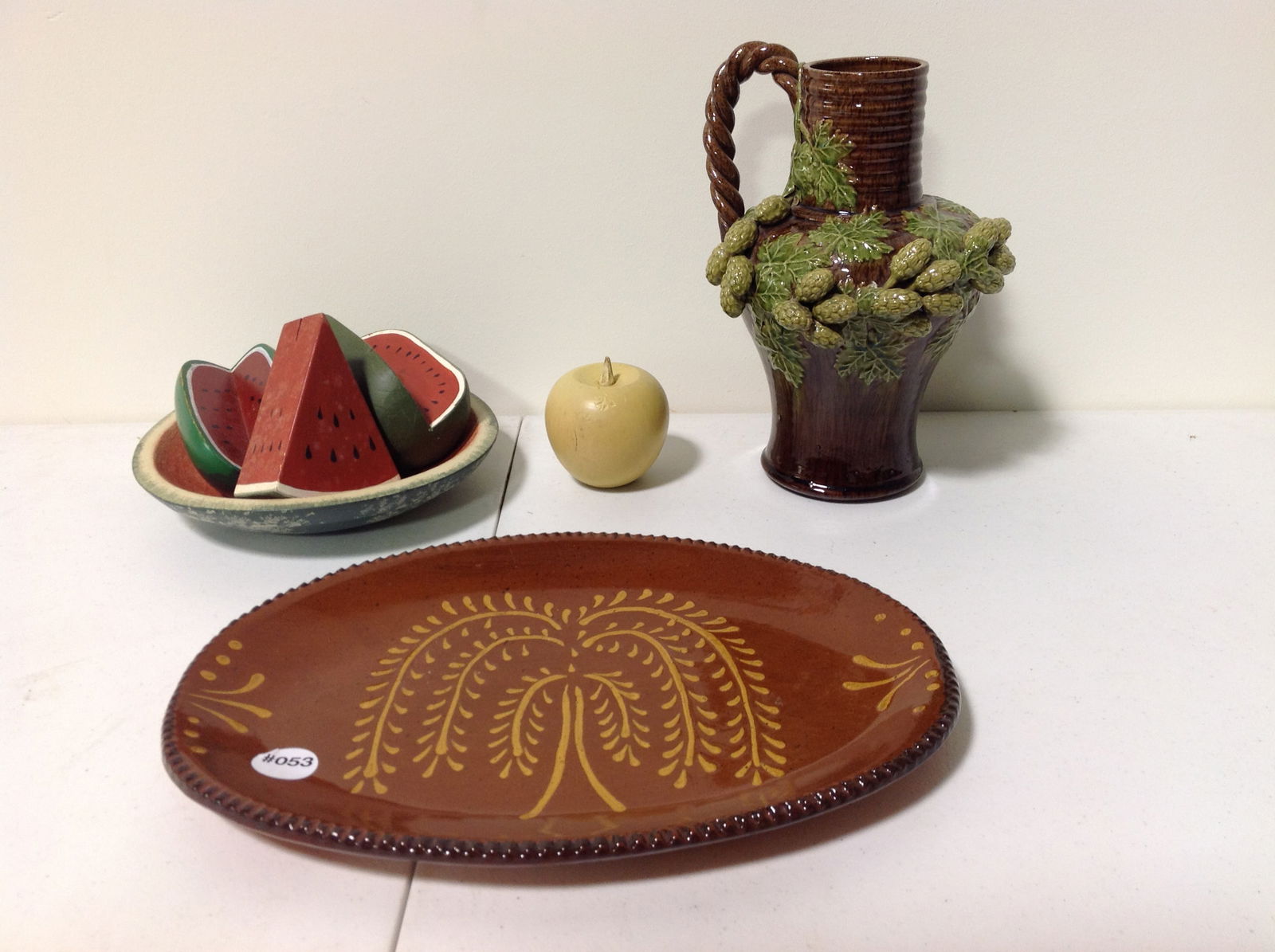 Pottery and Wooden Fruit: includes signed ewer 10"H, 13" signed redware platter and painted wooden fruit