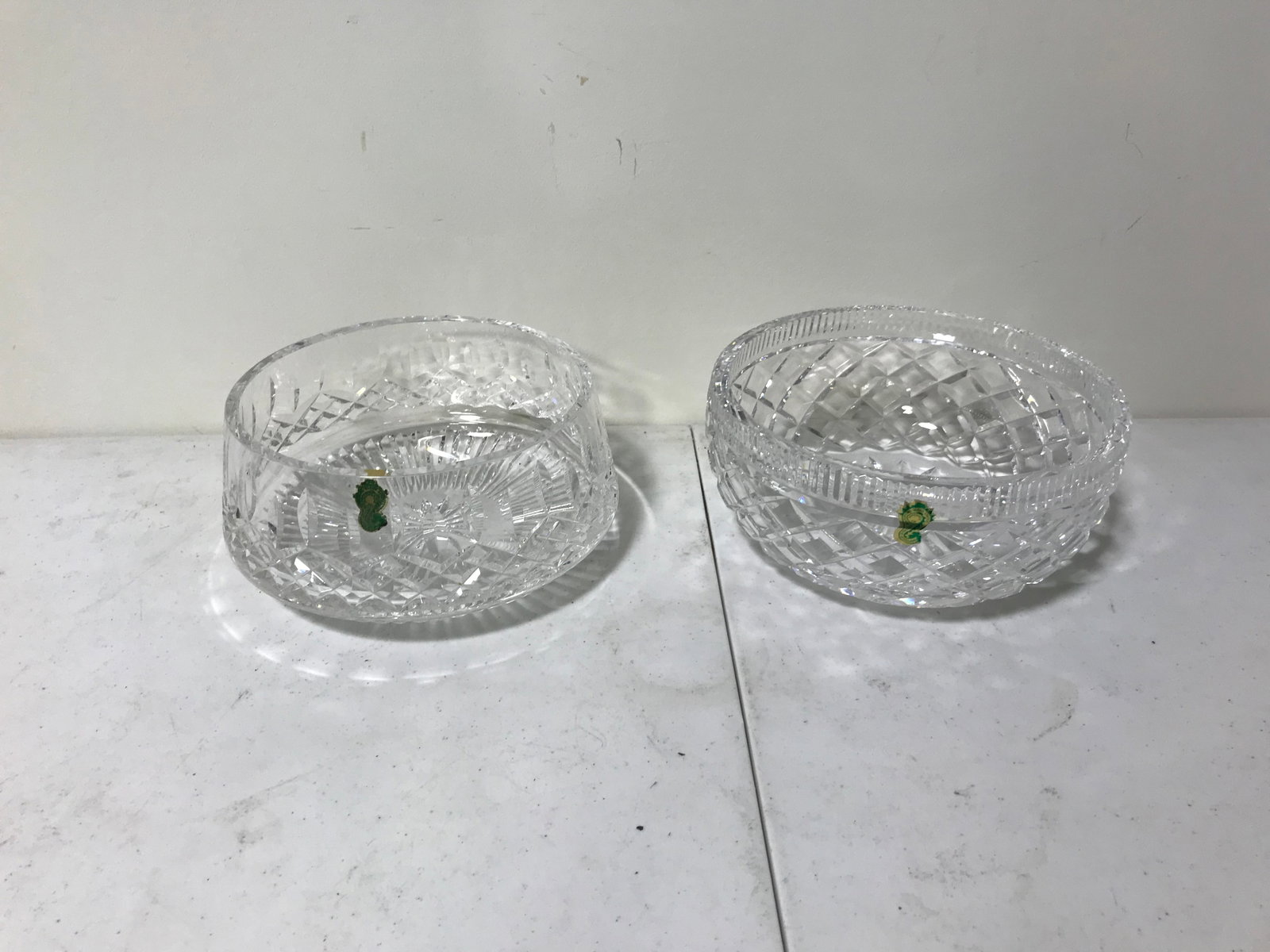 (2) Waterford Bowls: One bowl has original sticker. Includes Lismore and diamond faceted. Both 8" wide.