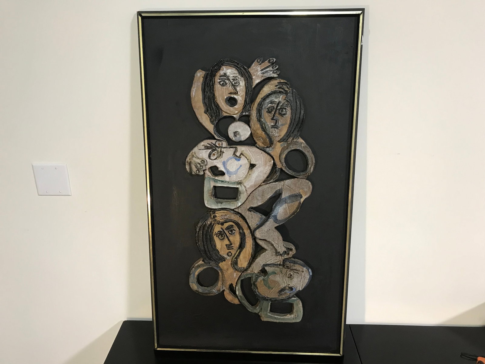 Ginger "Virginia" Wright (1940-2021): SLL, "Ginger 68". hand carved abstract showing various people cut from stone place on to a wooden frame. 26"x42".About the Artist:Ginger (Virginia) Wright (1940-2021) exhibited a flair for art and fas