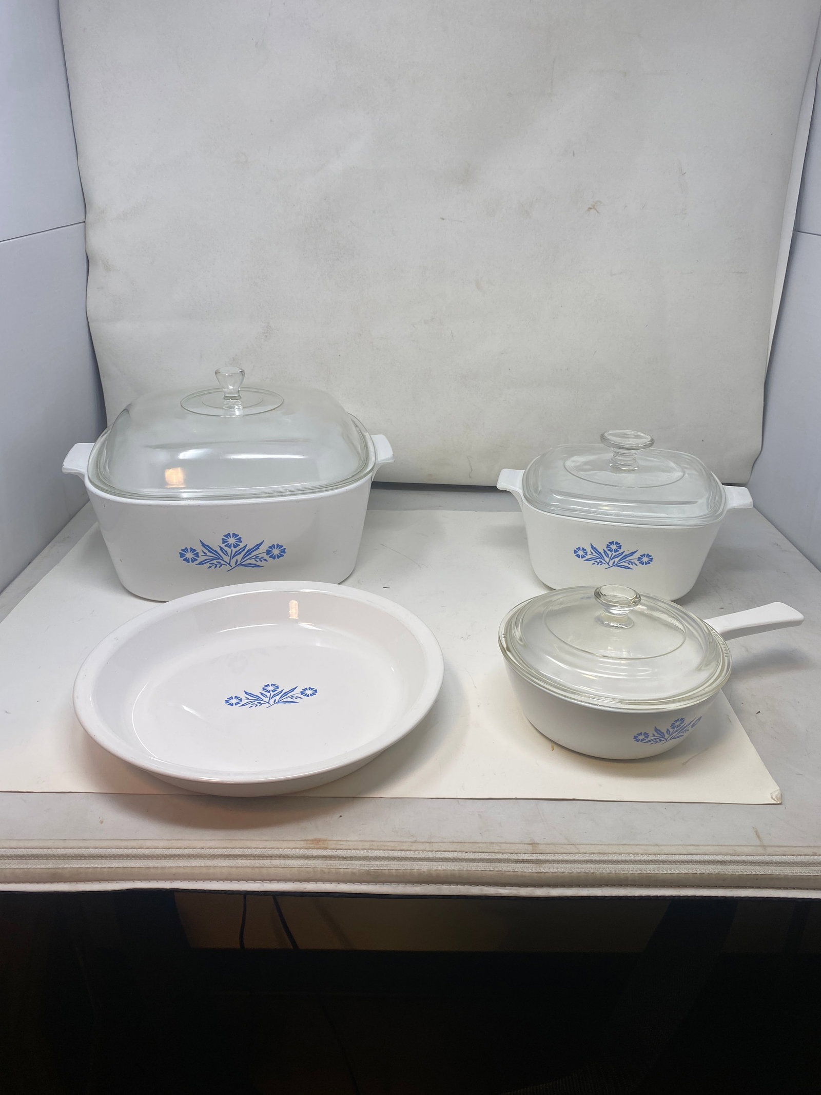 Corning Ware: 4 pieces, largest is 7" x 12", smallest is 10" round