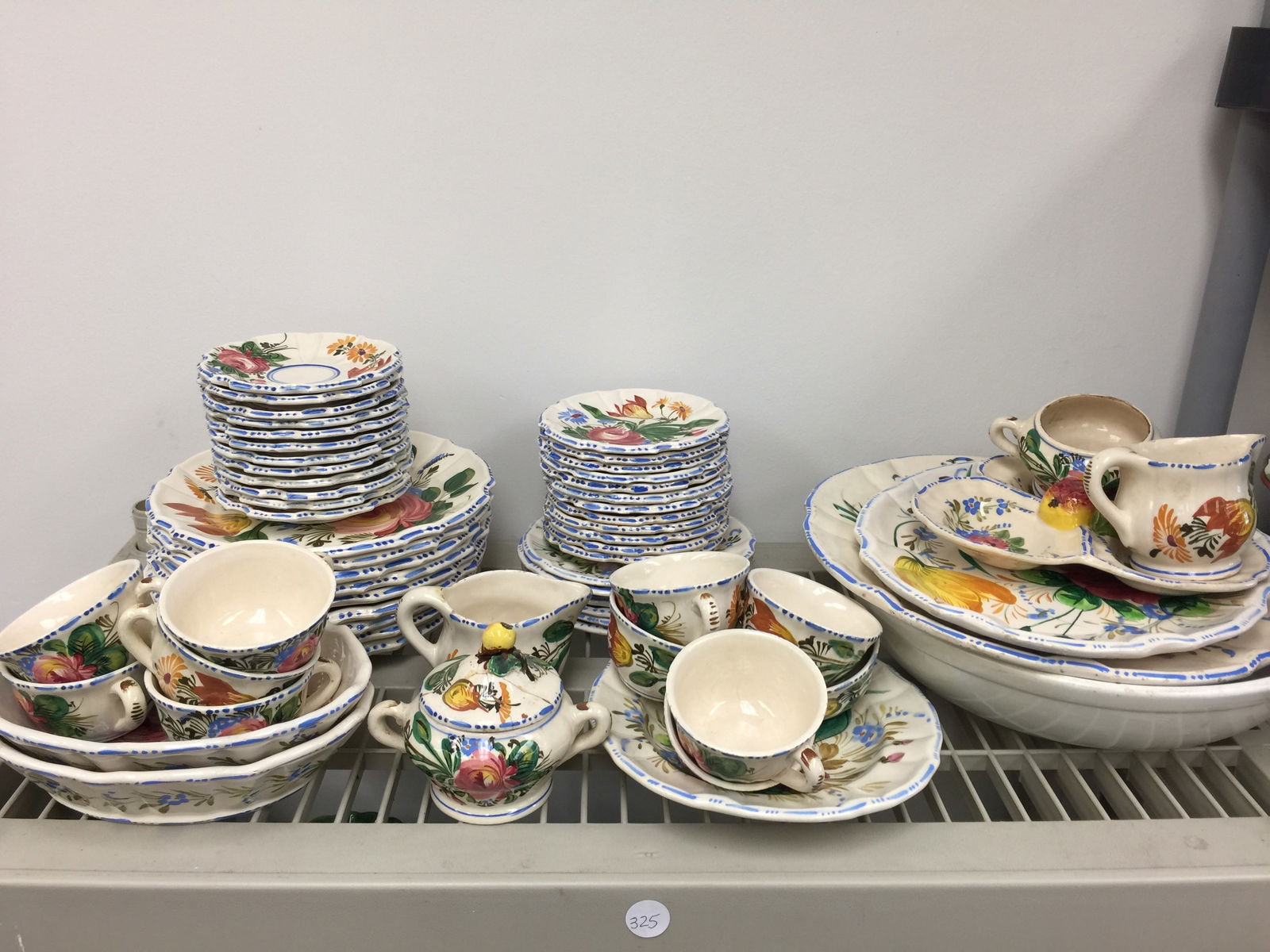 Selection of Italian Dinnerware: Includes dinner plates, serving pieces, cups saucers and more. Largest serving bowl 13" round.
