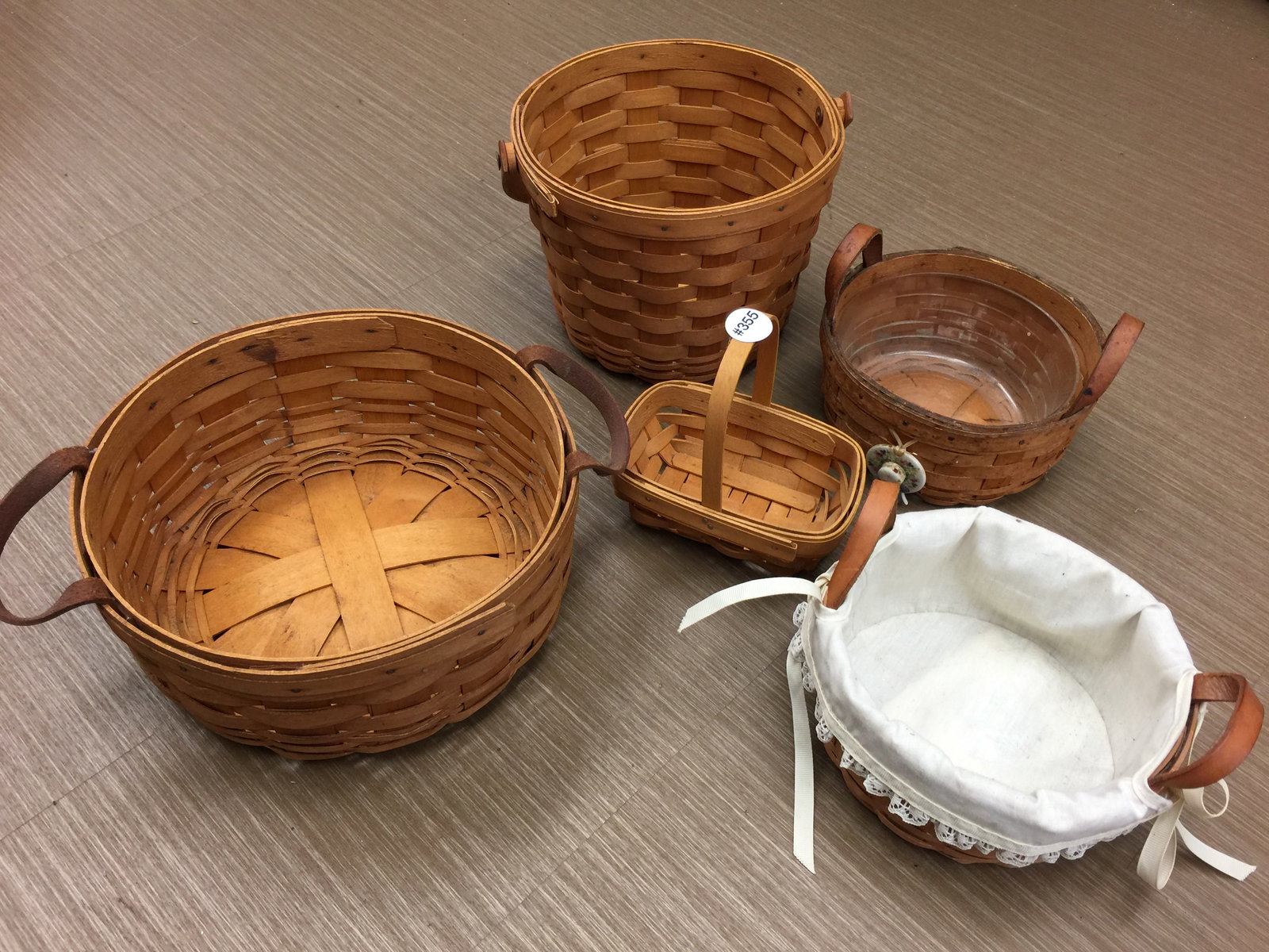 5 Longaberger Baskets: All signed. Largest 10" round, smallest 6" round.