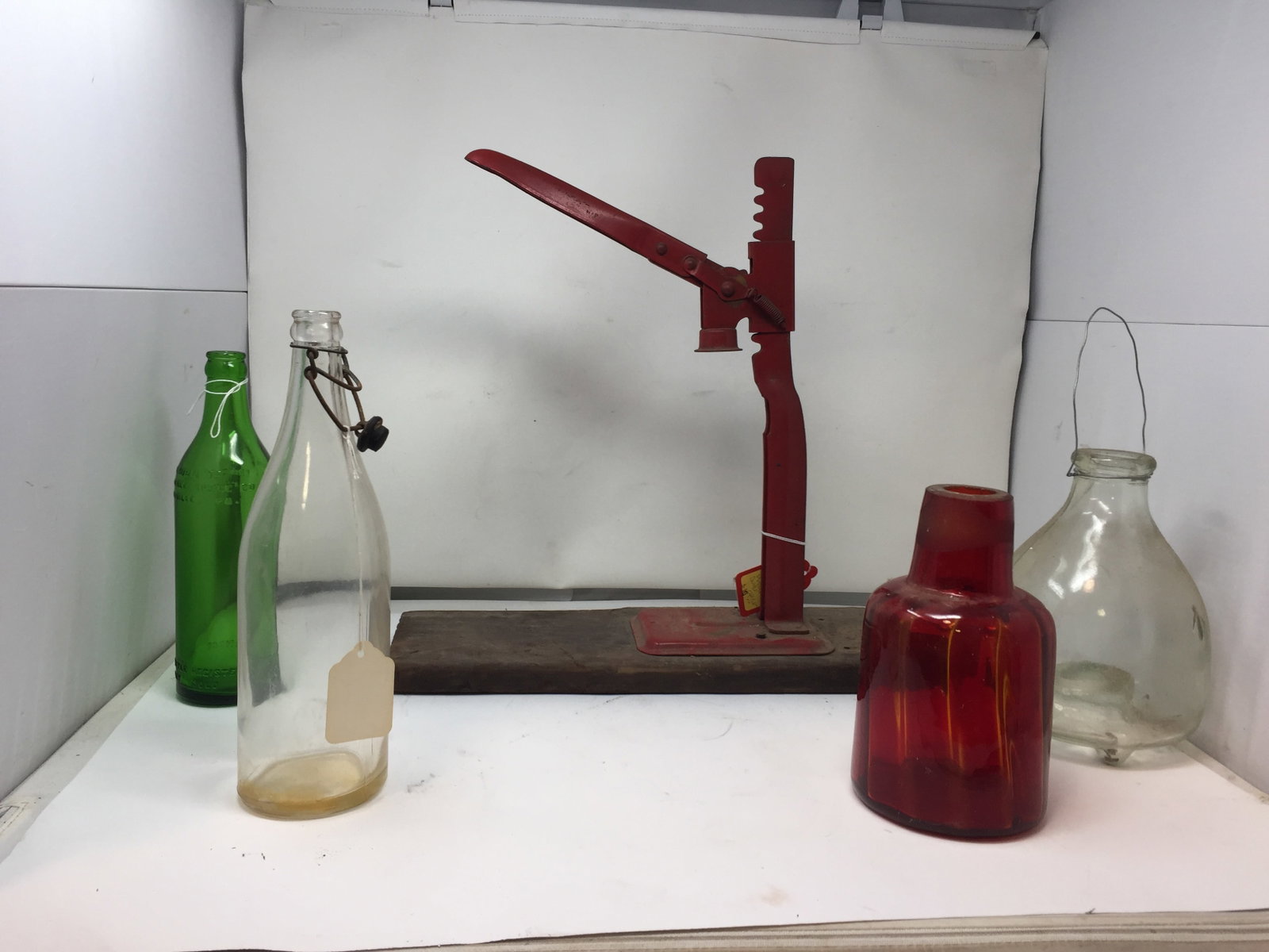 Bottle Lot: includes colored glass bottles and antique bottle opener. opener 17"H.