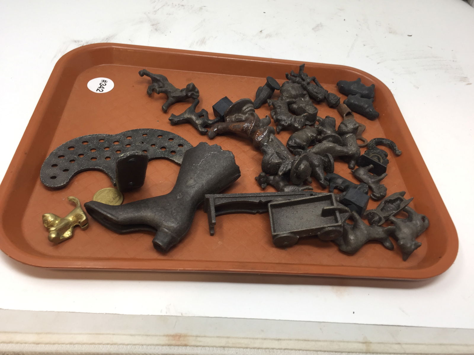 Cast Iron Lot: includes many miniatures, and other pieces of cast iron. largest 5".