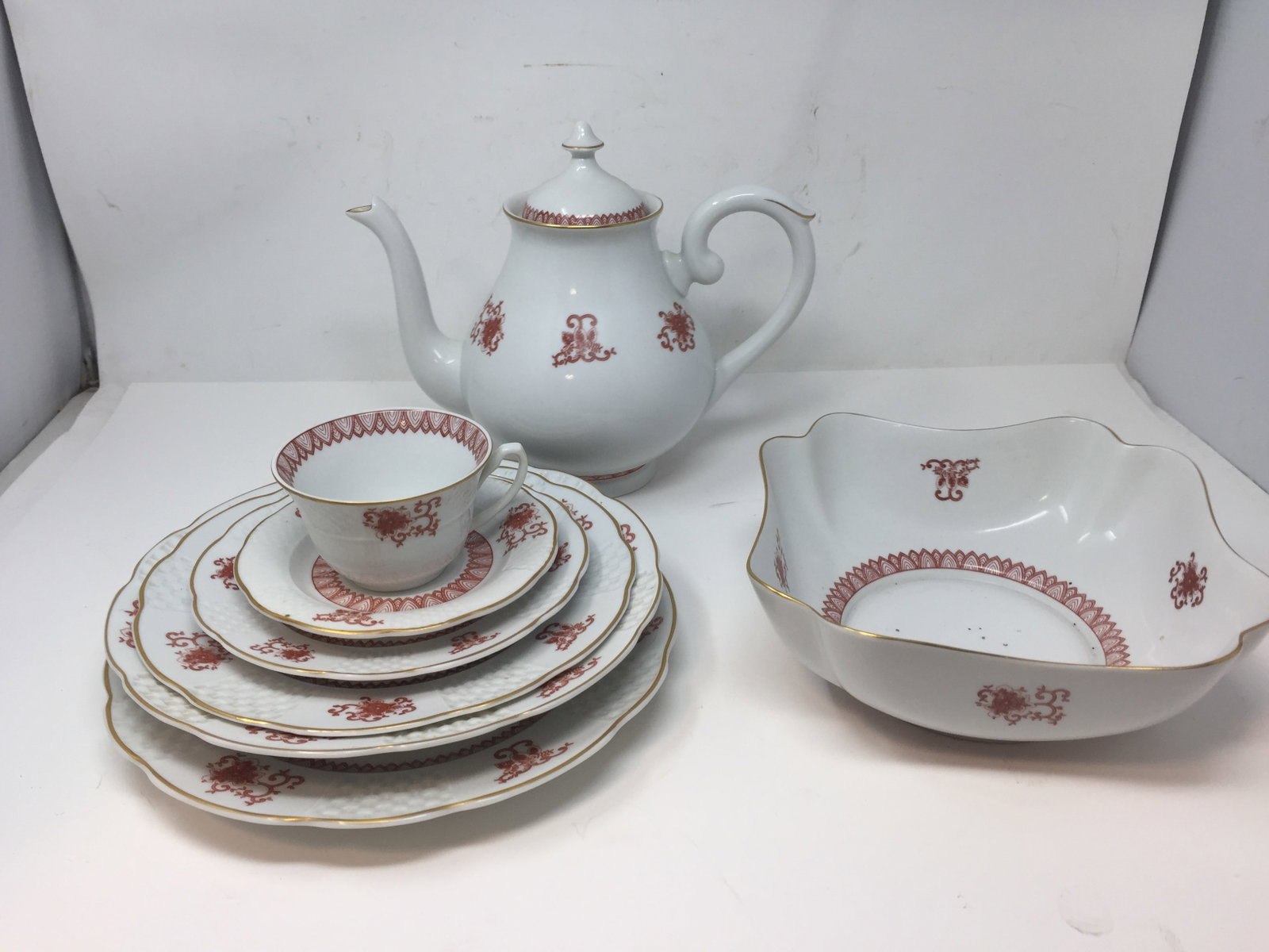 Eight Pieces ofMottahedeh Porcelain: Includes a 9" x 10" tea pot, 9" bowl, and 1 matching 6 piece dinner set. All signed on bottom.