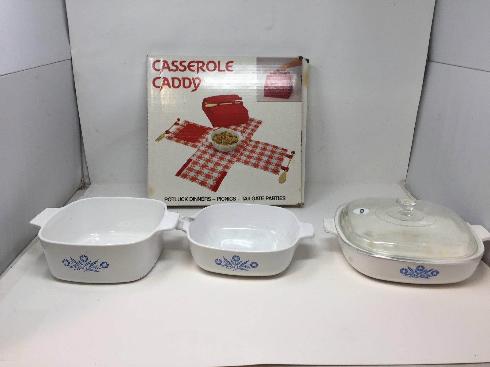 Corning Ware: 3 pieces, 1 with lid is 4" x 10" x 8", includes casserole caddy in original box