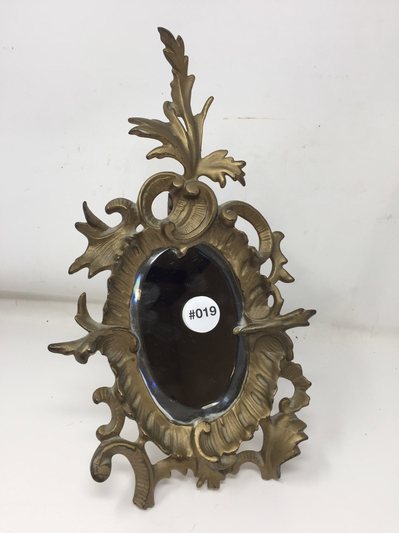 Art Nouveau Metal Mirror: 12" H, beveled glass.