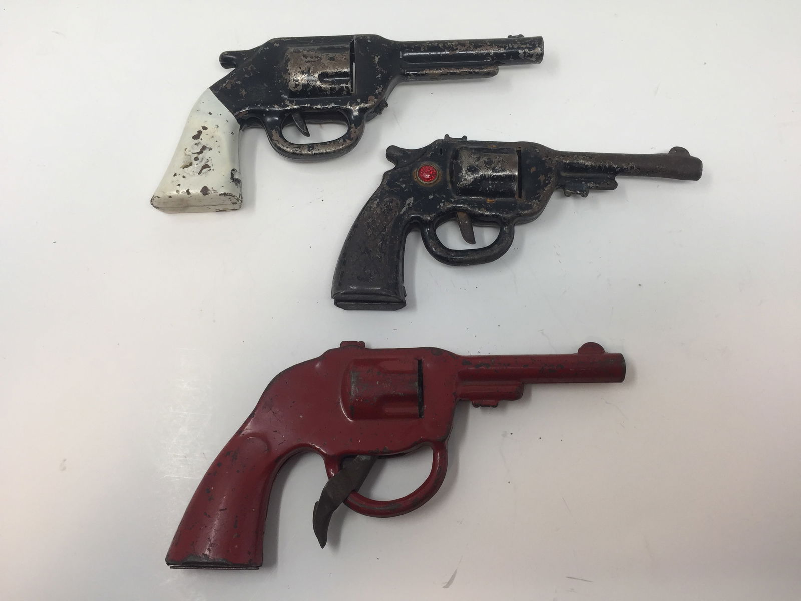 3 Vintage Cap Guns: Unmarked. Largest 9" L.