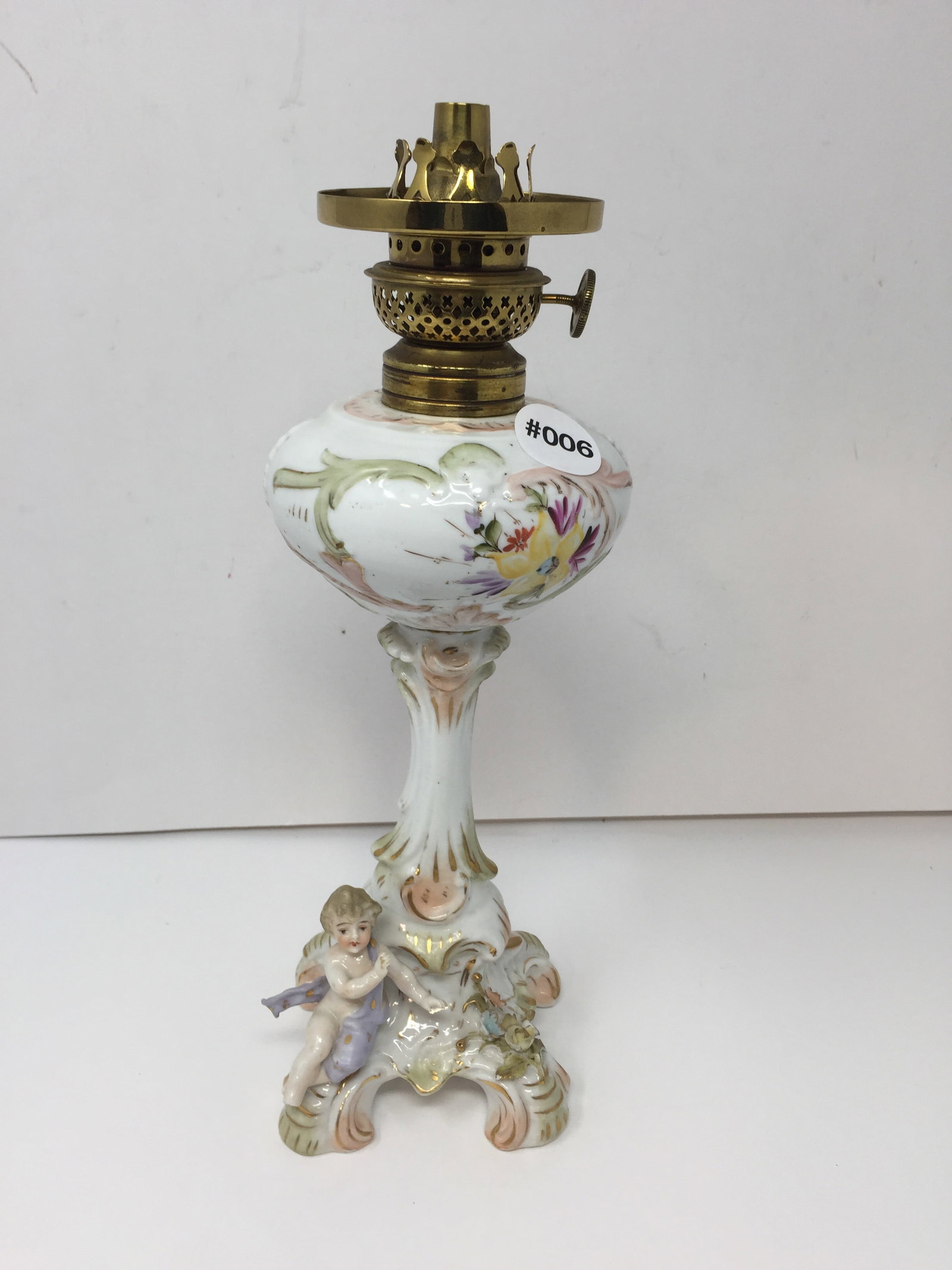 JE Caldwlel Porcelain Putti Fluid Lamp: 12" x 4" x 4", signed on dial