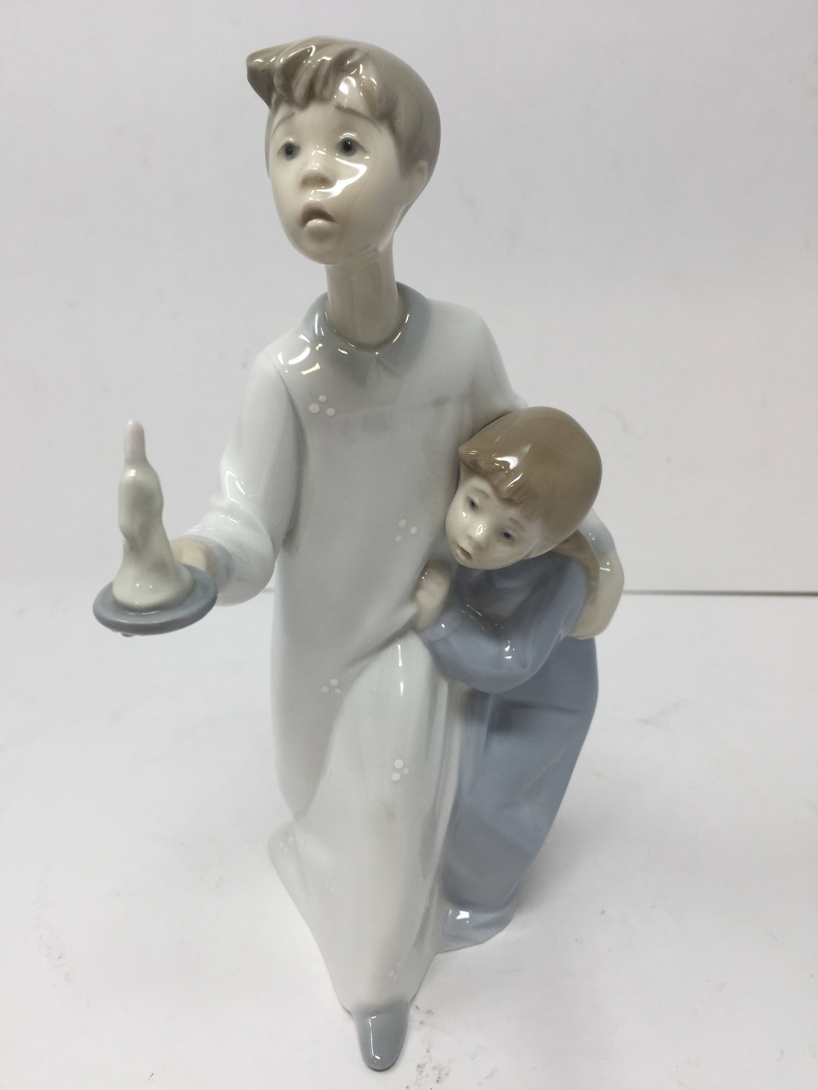Lladro "Boy in Night": 8"H.