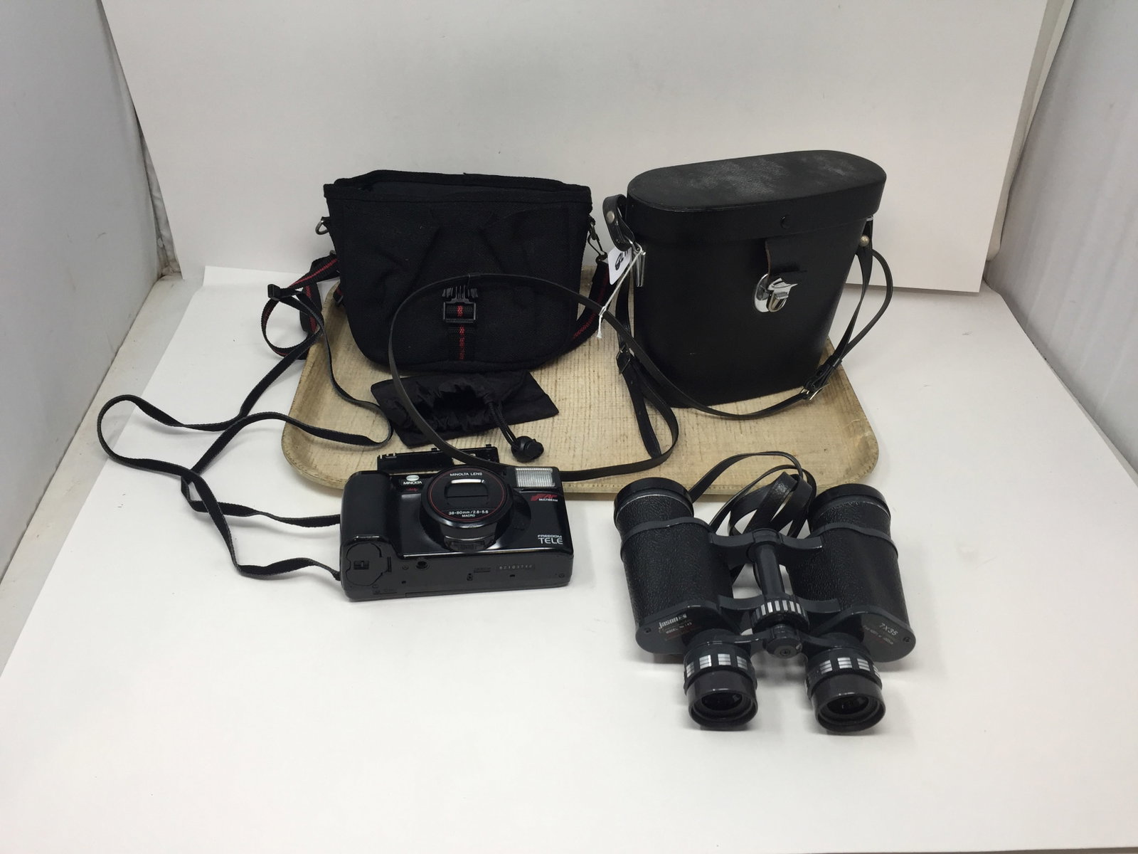 Camera and Binoculars: Minolta 82103748 and Jason 7x35.