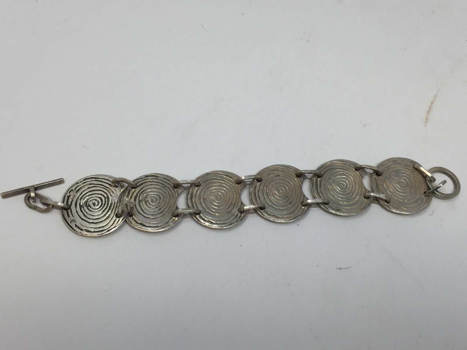 Signed Sterling Navajo Bearpaw Bracelet: singed "AWE", measures 7.75", 2.12ozt.