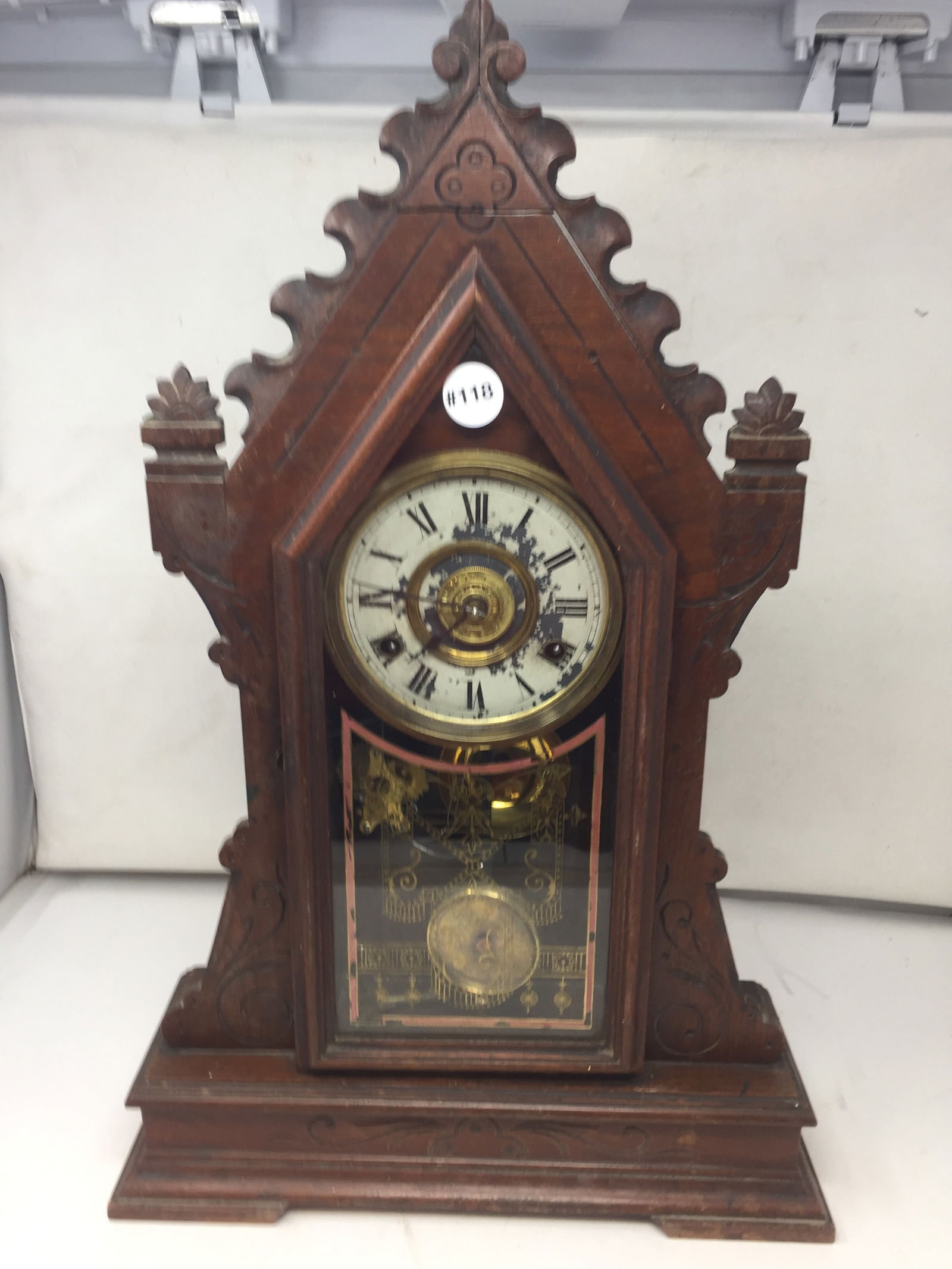 New Haven Mantle Clock: has carved walnut case, 22" x 14" x 5", includes key and pendulum