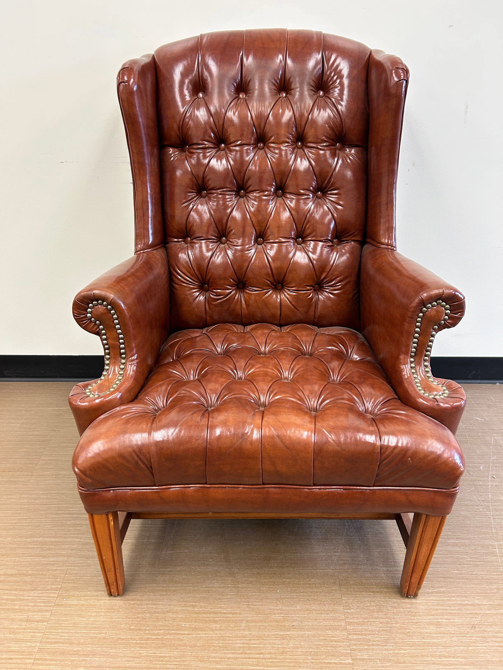 Leather Chair: 42" x 32" x 24". Has tufted back.