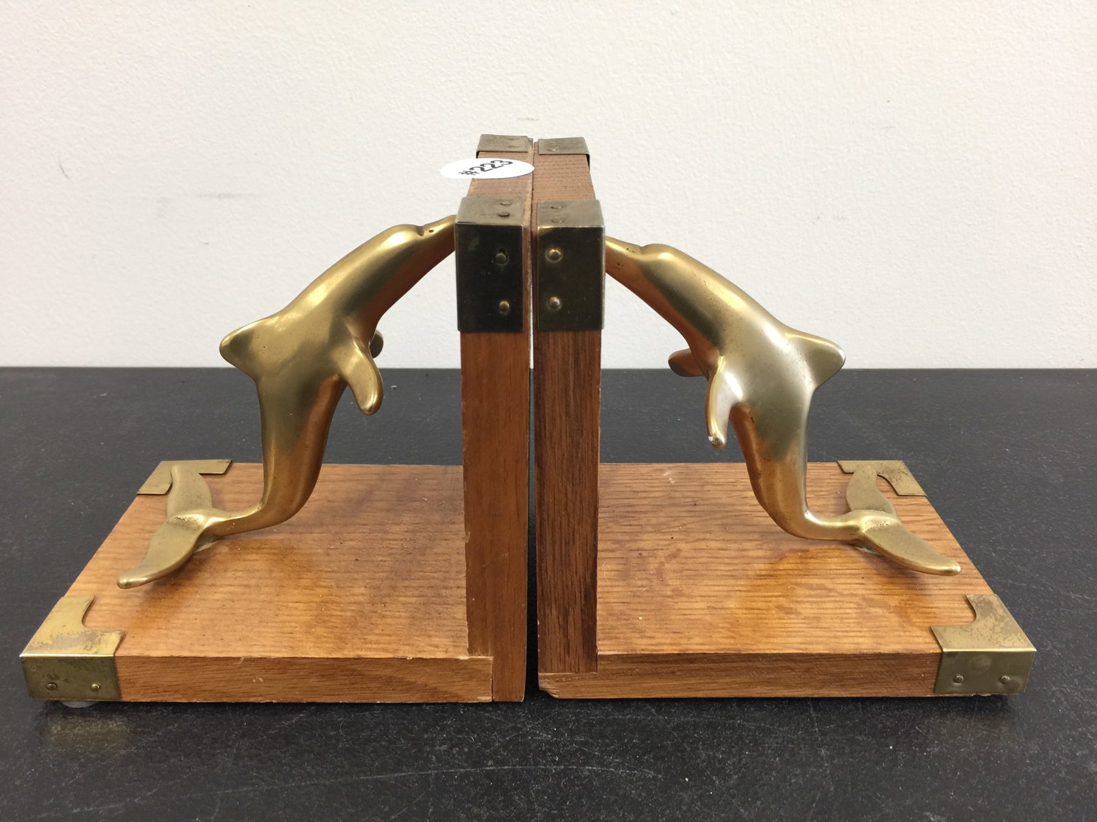 Pair of MCM Dolphin Bookends: Sticker on underside. 5" x 5".