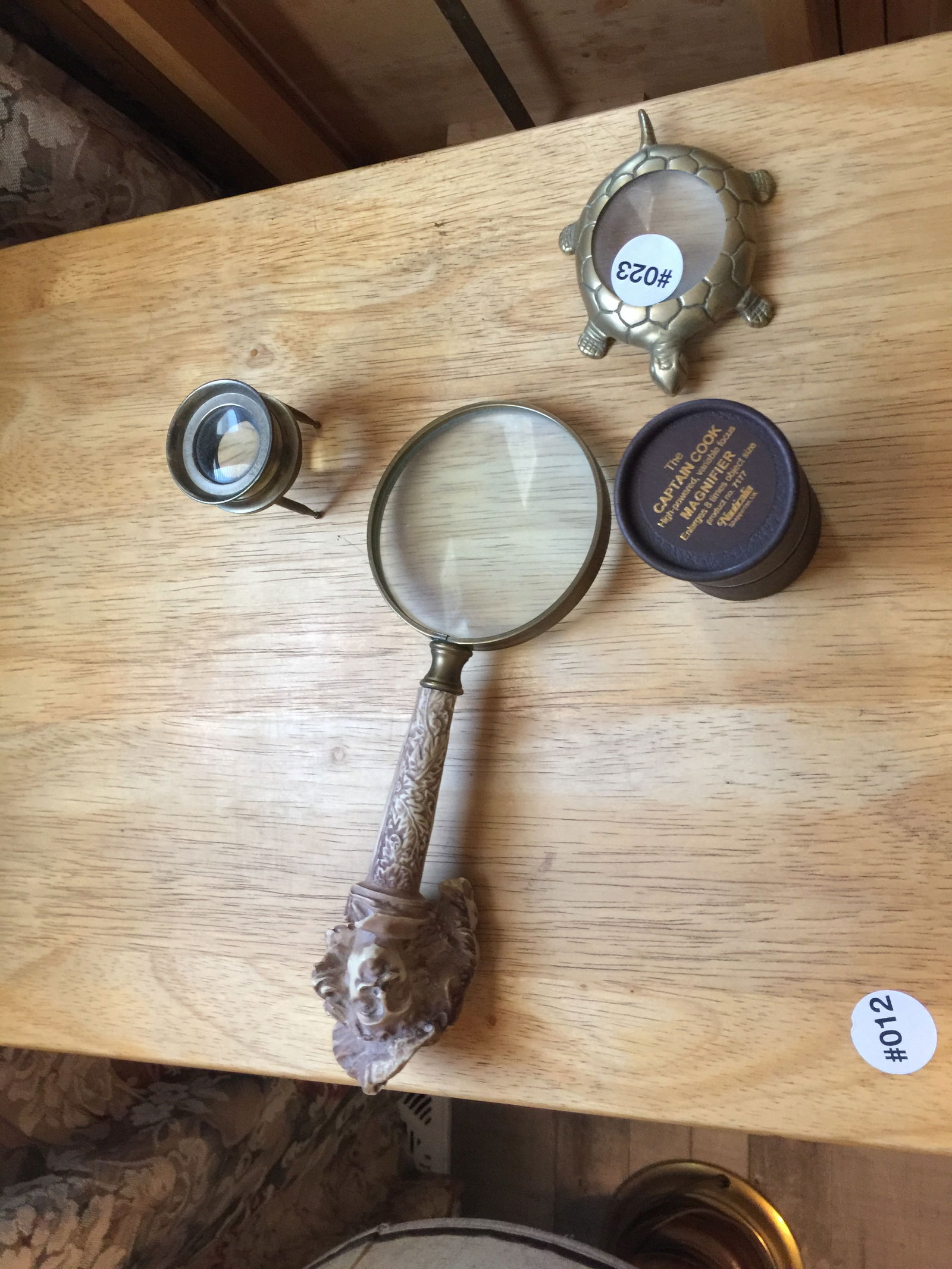 Looking Glass Lot: 3 total. Largest 10" L. One is a Captain Cook magnifier.