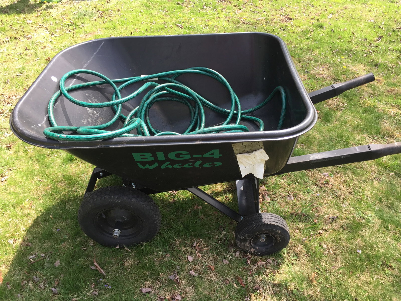 Wheel Barrow & Hose: Includes a Big Four Wheel Barrow & garden hose.