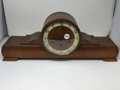 Art Deco German Mantle Clock: 9" x 24" x 5". Signed on face, includes pendulum.