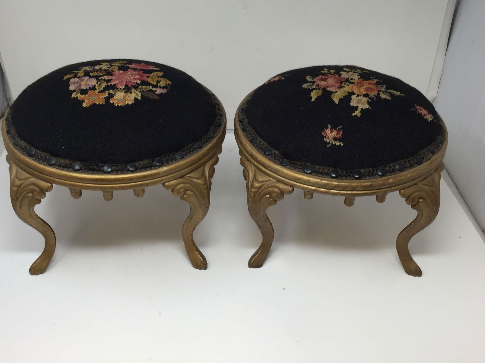 Pair of Needlepoint Stools: Sit on gilt metal bases. 8" x 10".