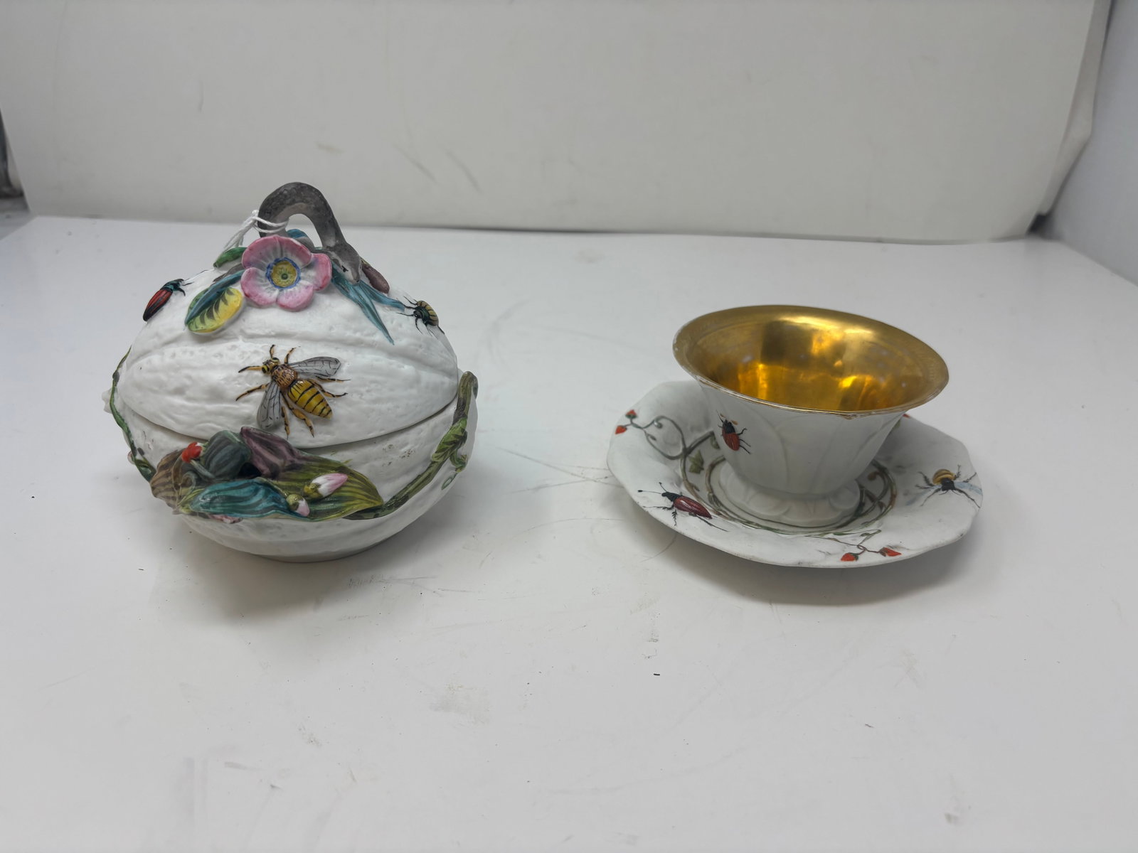 (2) Pcs Antique Schutz Blansko Majolica: lidded jar wit applied bug, snake and floral design. Cup and saucer with embossed plant and insect decoraiton.