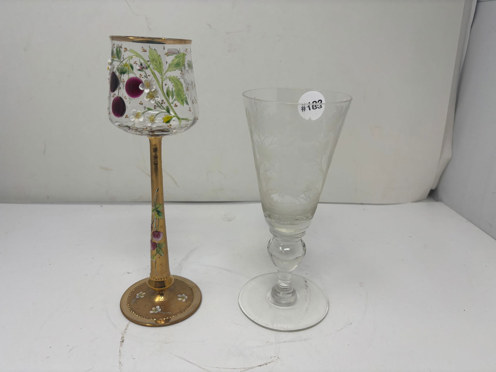 (2) Antique Glass: enamel decorated wine stem with applied decoration and etched wildlife goblet. largest 9.5"H.