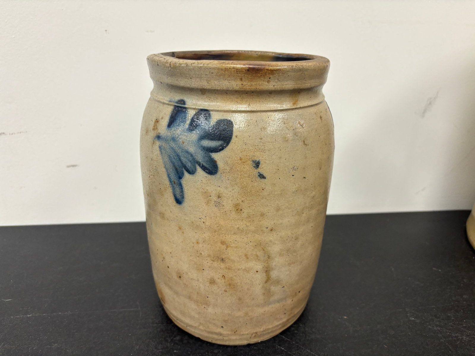 Stoneware Crock: attributed to remmery out of phila. pa, blue foliate decoration, 9"H.