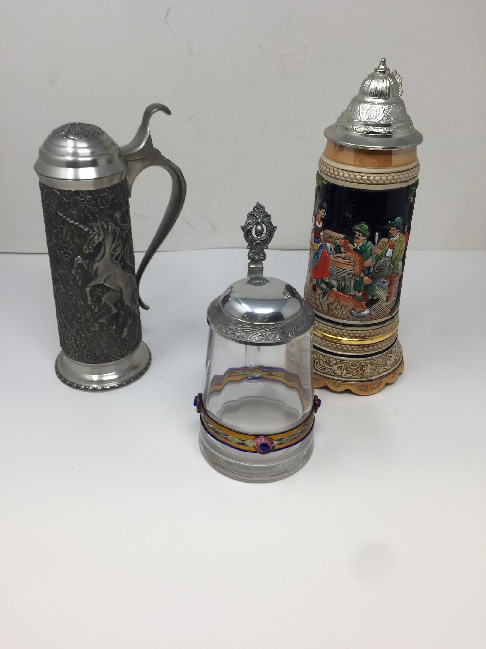 (3) German Steins: 1 pewter 9" tall, 1 German musical 10" tall and 1 clear glass