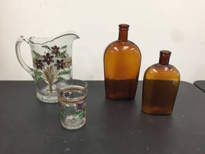 Early Glass Lot: two blown amber bottles with painted glass. Largest 10"H.