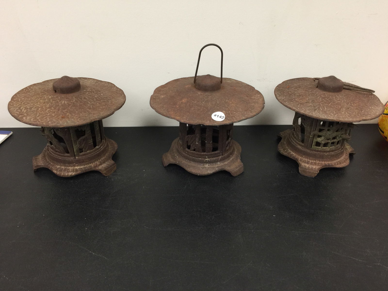 (3) Cast Iron Lanterns: Two are a matched pair, one singular. Largest measures 10" W.