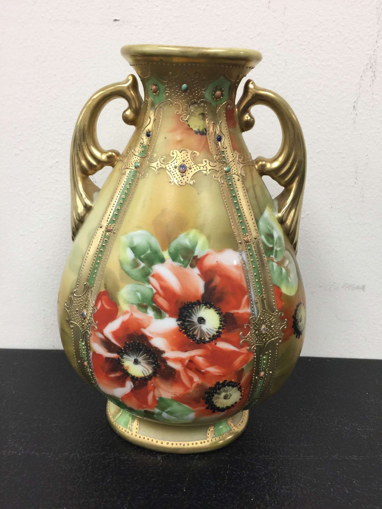 Hand Painted Nippon Vase: 8" x 5", signed on bottom, has 2 gilt gold handles, raised jewel decoration