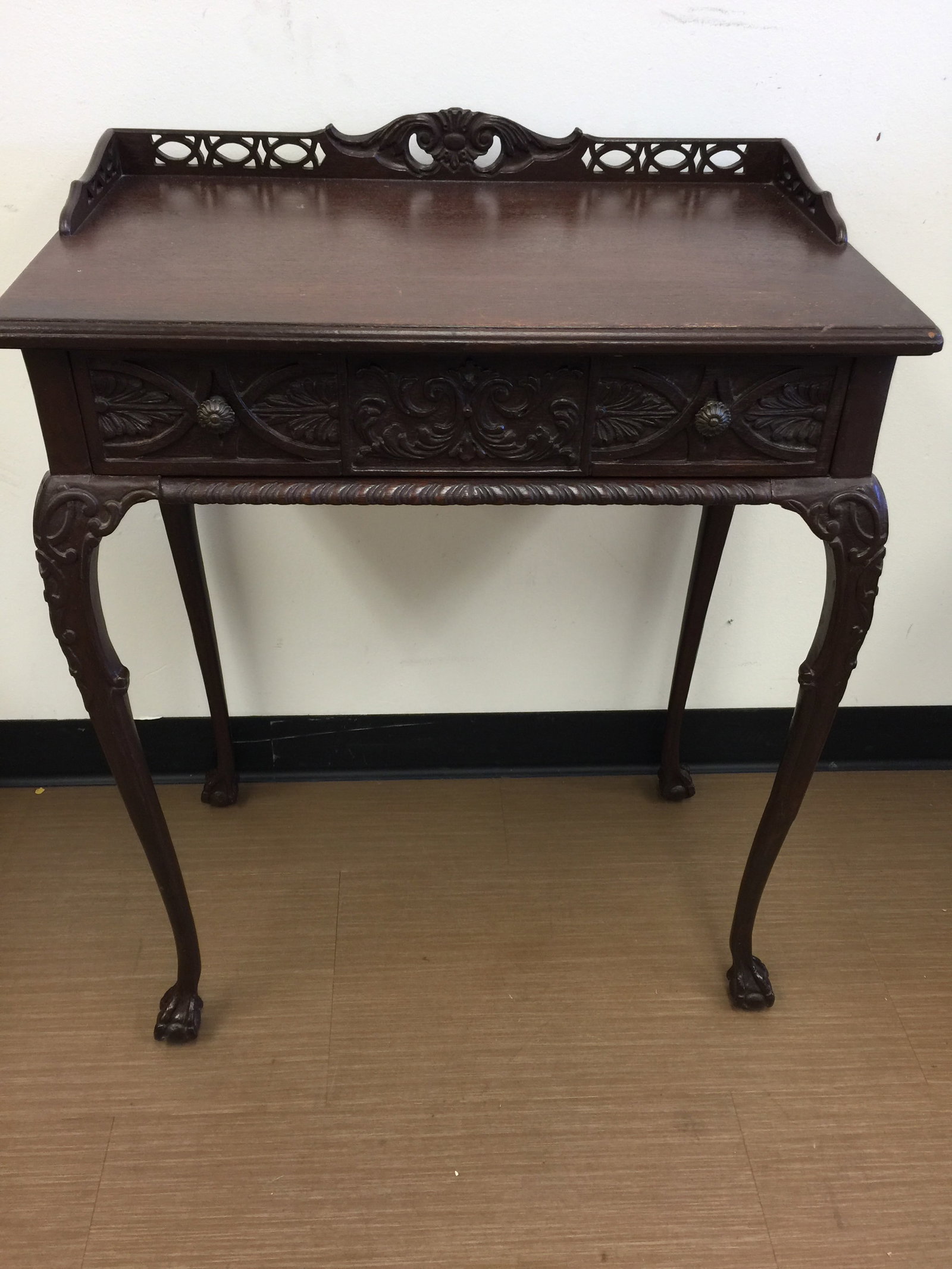 Carved Petite Mahogany Writing Table: 25" x 15" x 32". Highly carved.