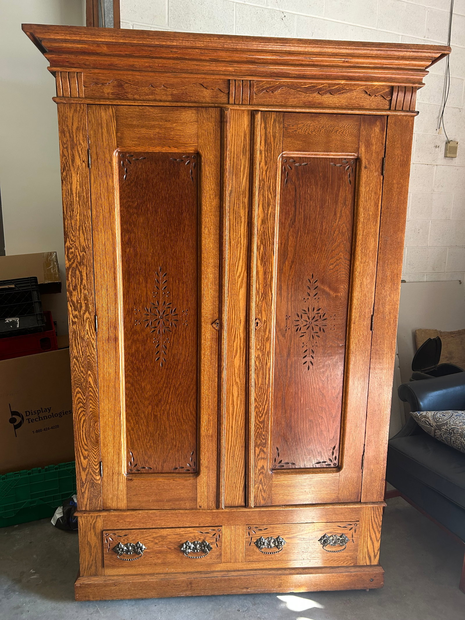 Antique Oak Wardrobe: knock down version, 51" x 18" x 95", has butterprint design and applied carvings