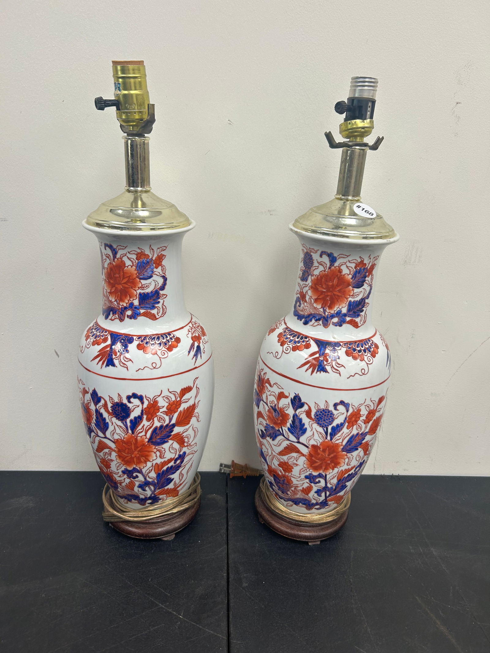 Pair of Imari Lamps: 22" x 6", hand painted and sits on wooden bases