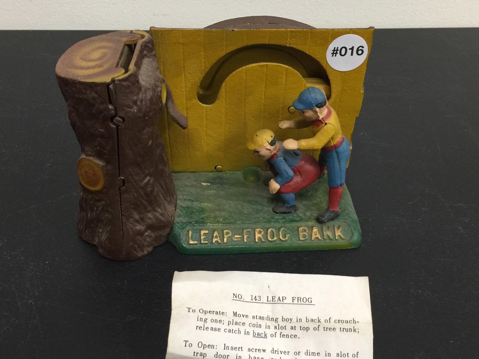 Book of Knowledge Mechanical Bank: has paperwork, 8"L.