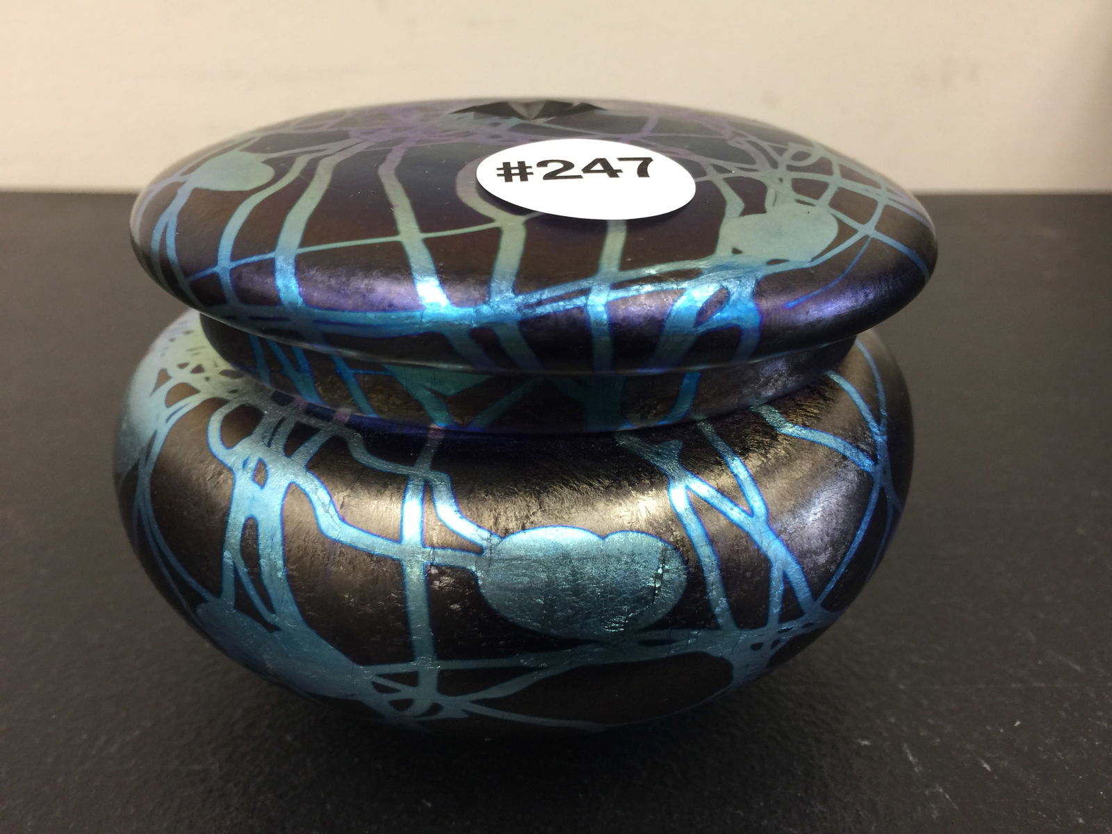 Durand Iridescent Art Glass Covered Jar: blown base, starburst cut design on lid. 3"x5".