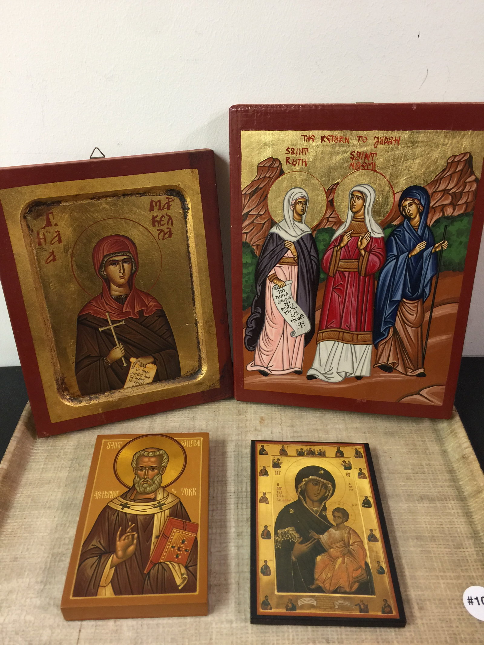 4 Russian Ikons: All painted on wood, largest 8.5" x 11".