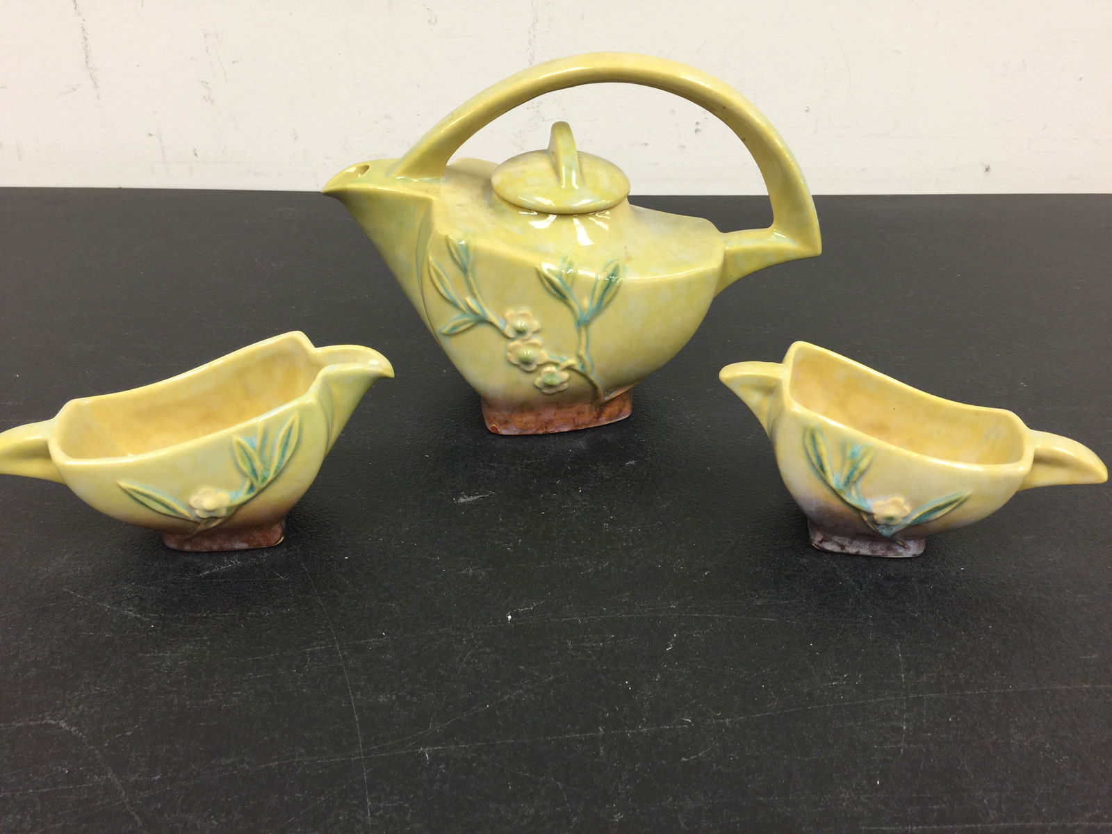 Roseville Windcraft Tea Set: Tea pot 7" H. Includes matching creamer & sugar.