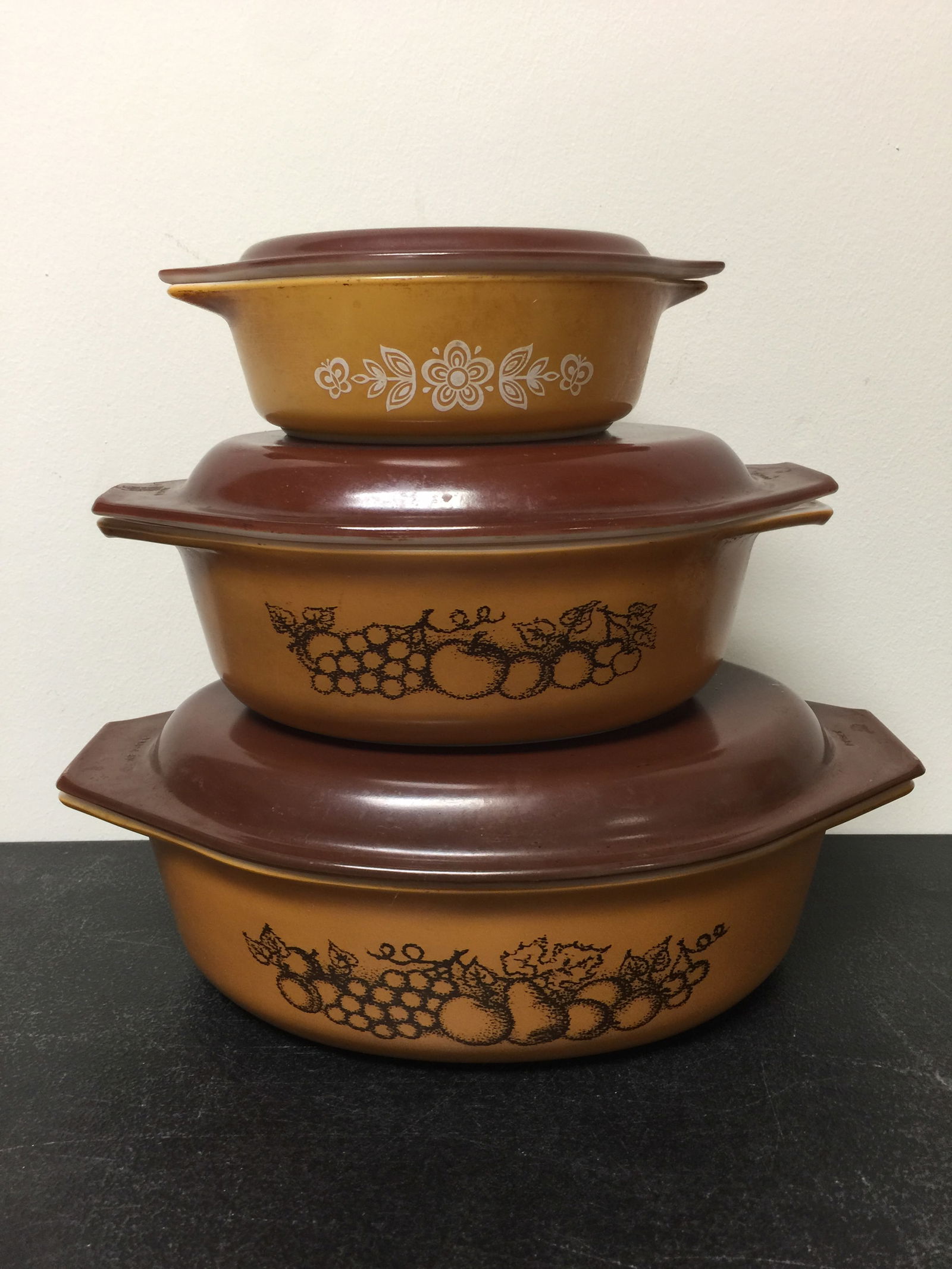 Pyrex Lidded Dishes (3): two pyrex old orchard, and one butterfly gold. largest 13".