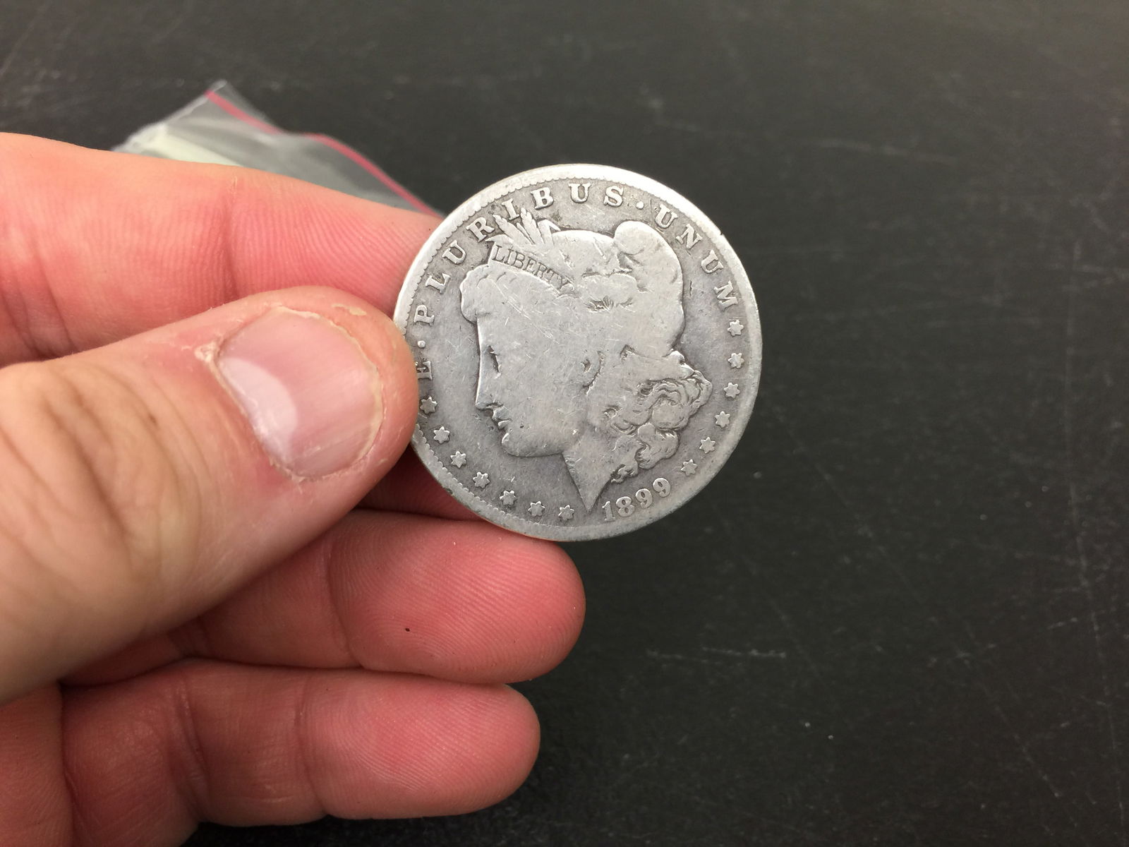 1899 Morgan Silver Dollar: 90% silver.