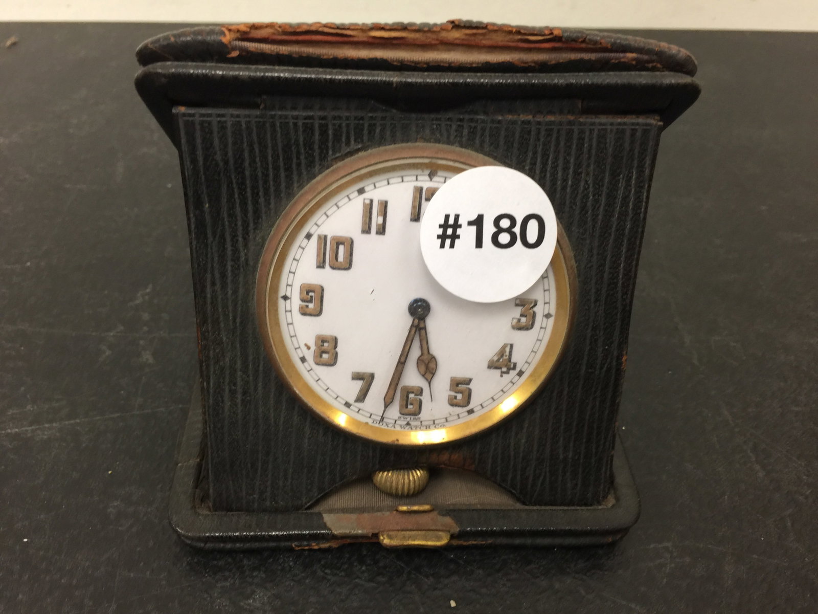 Art Deco Swiss Alarm Clock: In original leather case,signed on face. 4" H