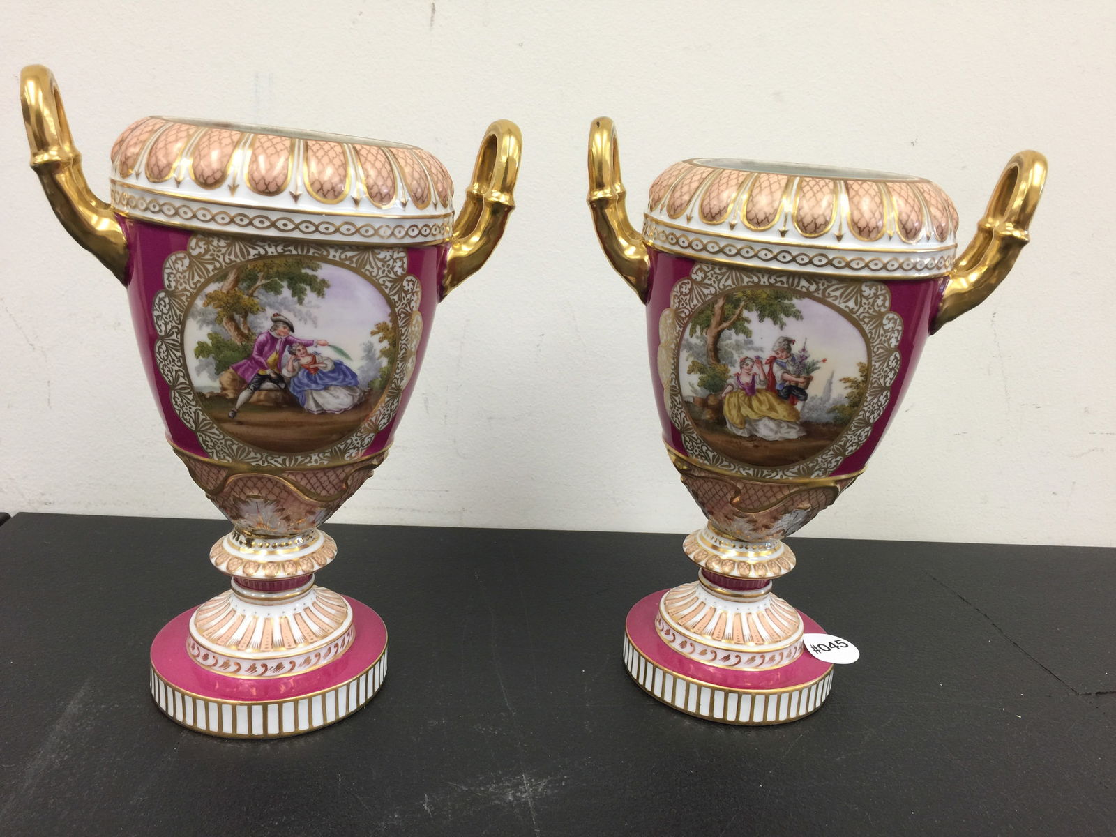 Pair Dresden Portrait Urns: four painted pictorial designs, with gold gilt and embossed decoration, 9"H.
