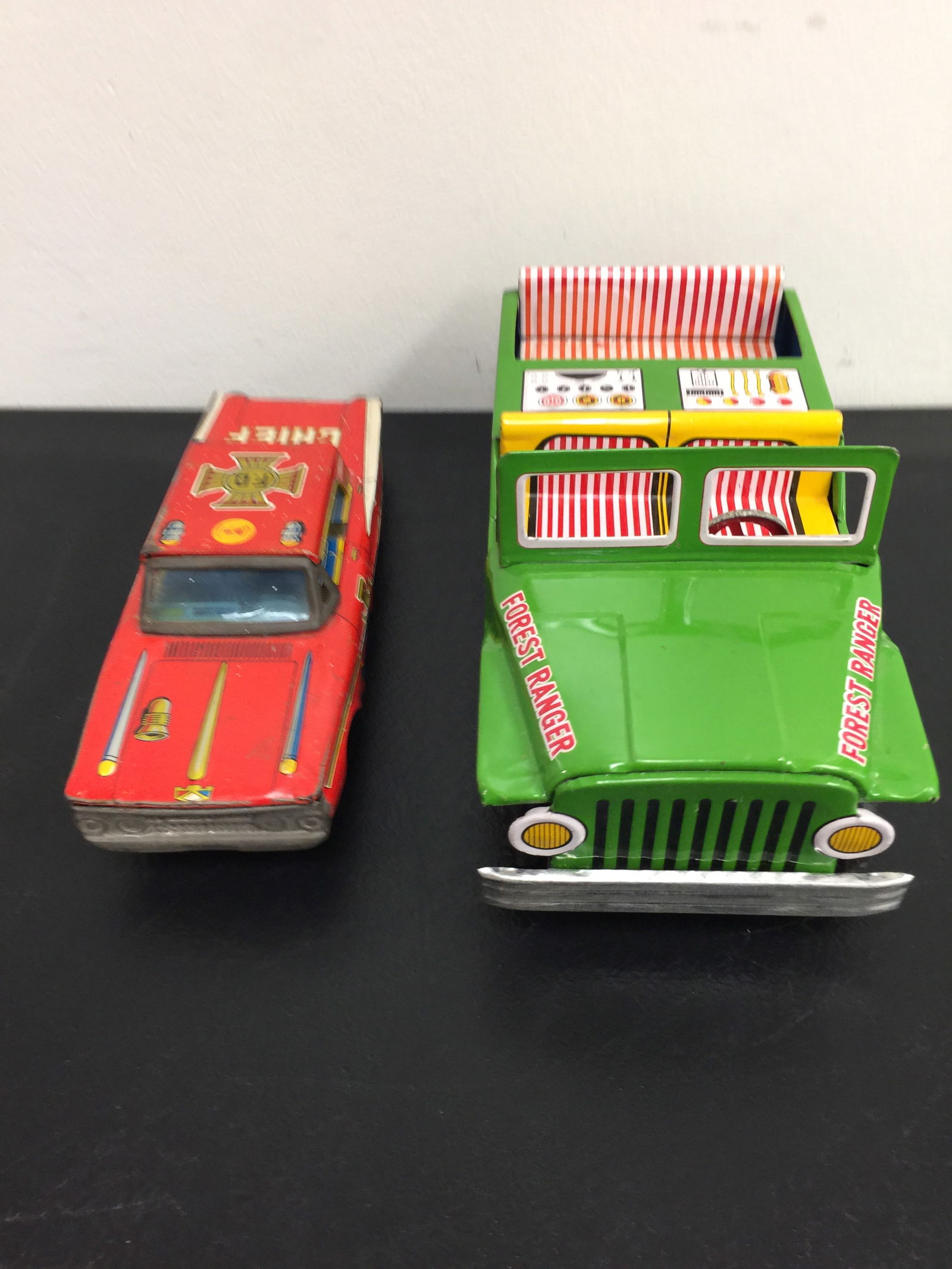 2 Vintage Friction Tin Toy Cars: both made in Japan, jeep is 10", fire chief is 9"