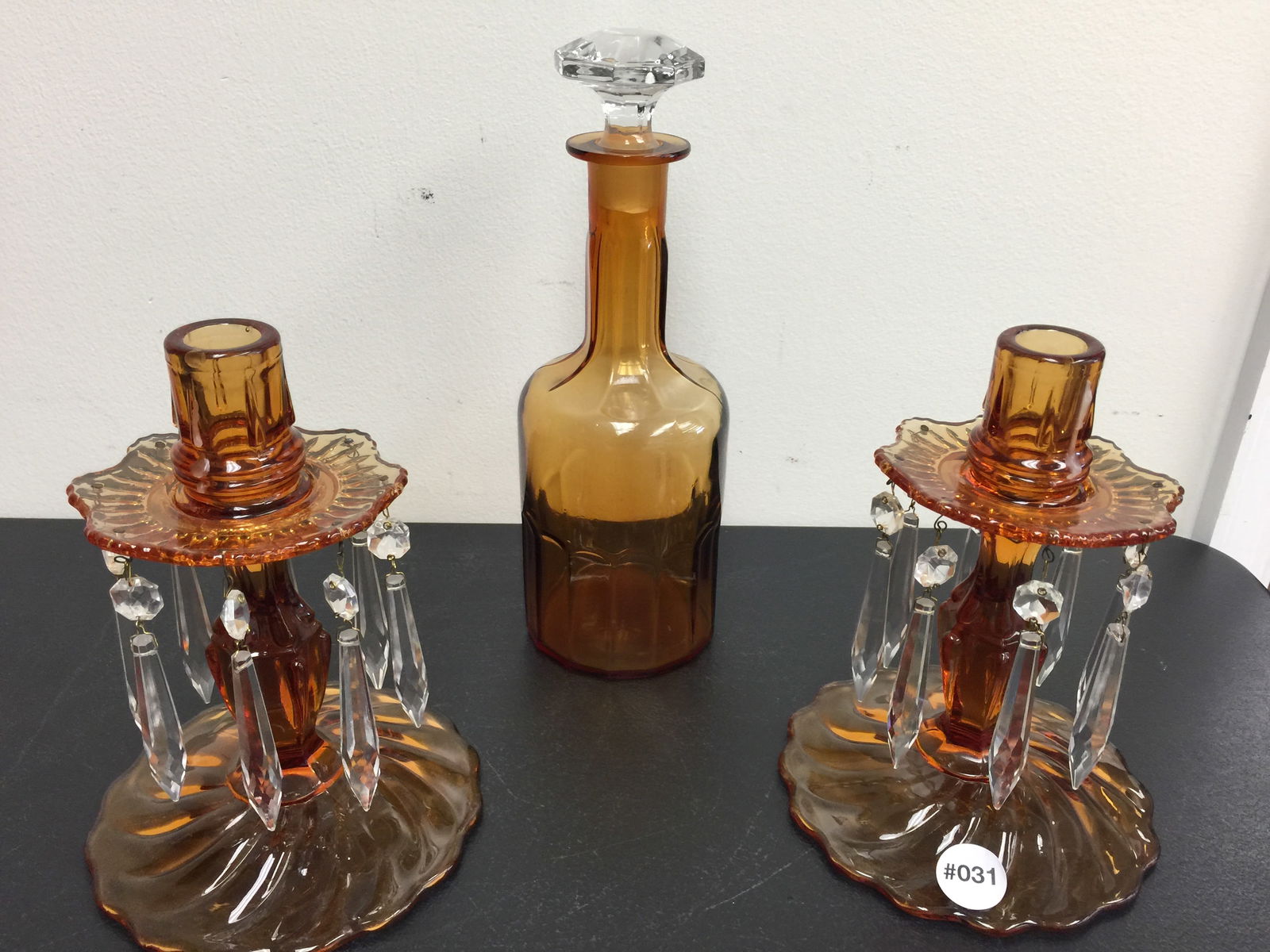 Amber Glass Lot: Includes an 11" H decanter and matching pair of 8" H candlesticks w/prisms.