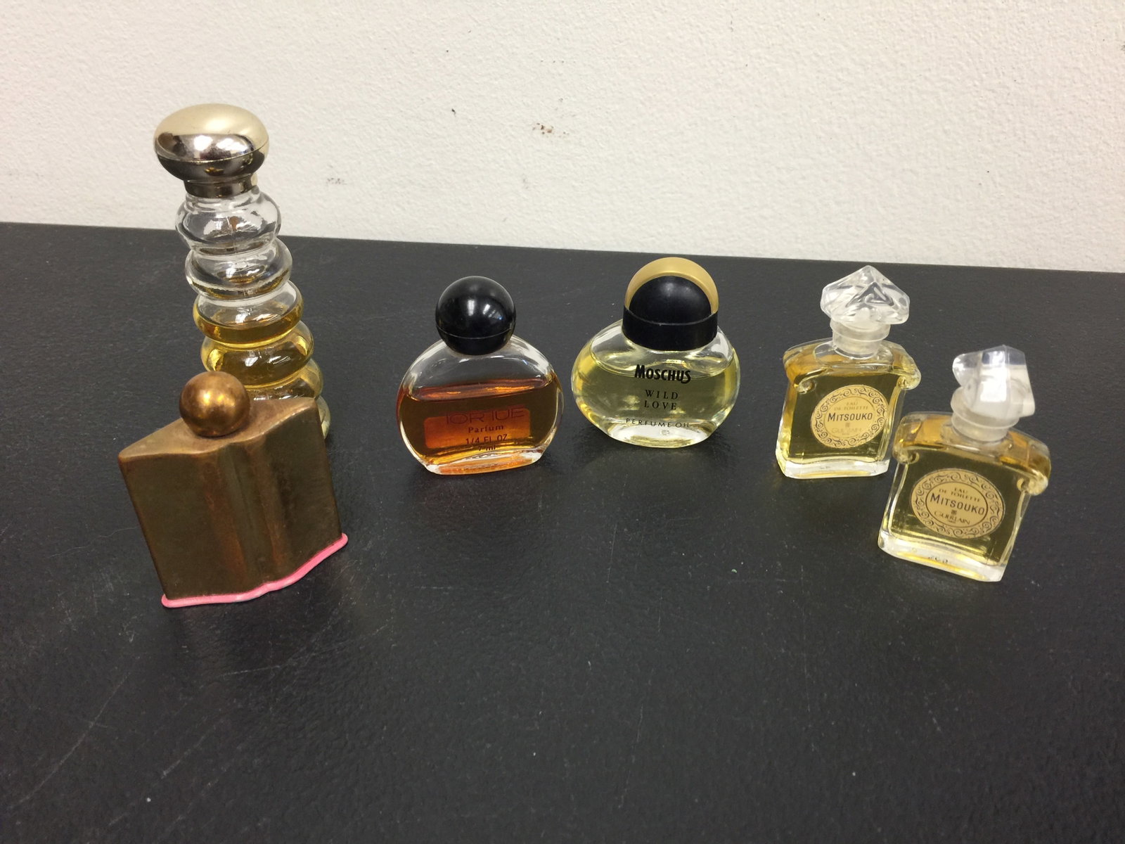 Perfume: Includes Moschus Wild Love, Tortue, Mitsouko and more. Tallest bottle is Avon, 3.5" H.