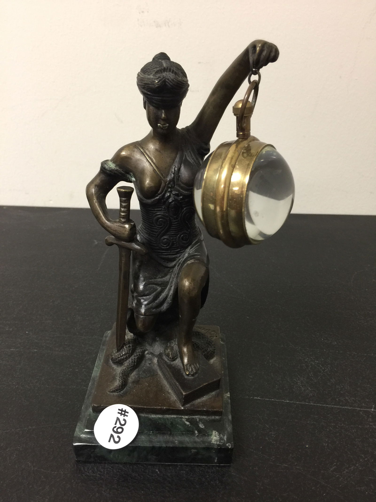 French Bronze Mystery Clock: works marked "Deco Swiss Made", 17 jewels. 8.5"H.