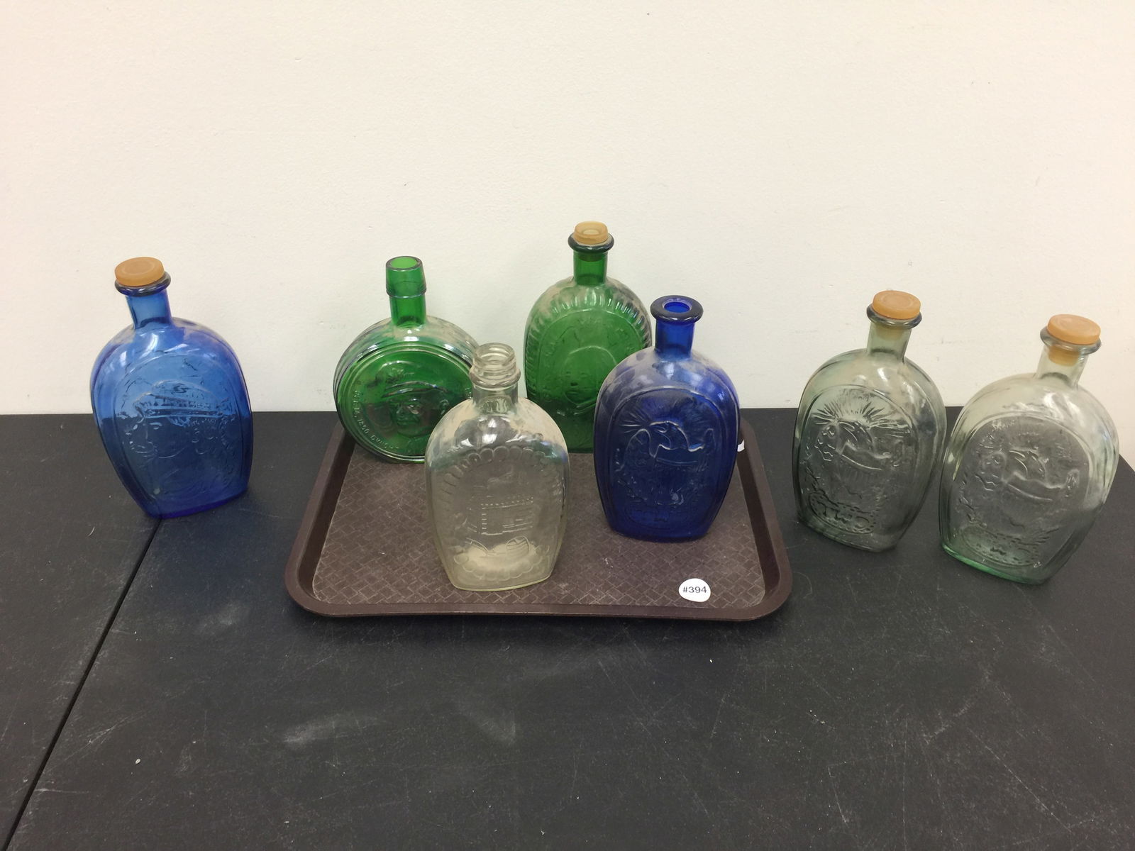 Decorative Flasks: Assorted colored flasks. Largest 9" H.