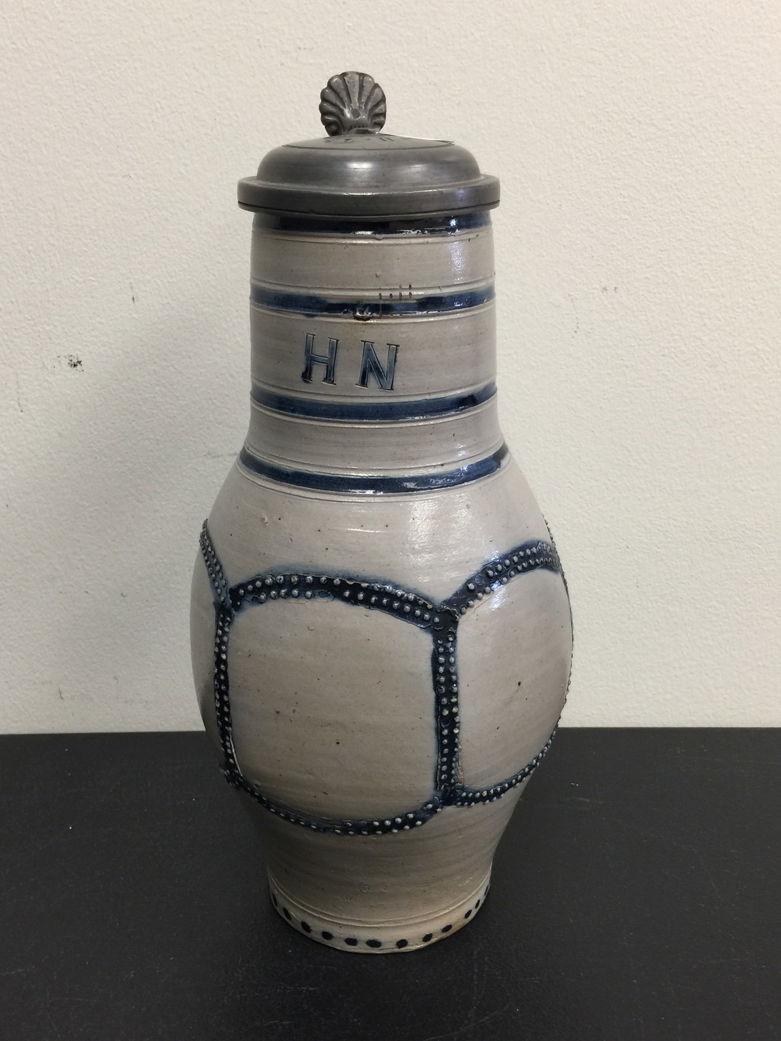 Antique German Stoneware Stein: 12" x 6". Has blue decoration, signed on front.