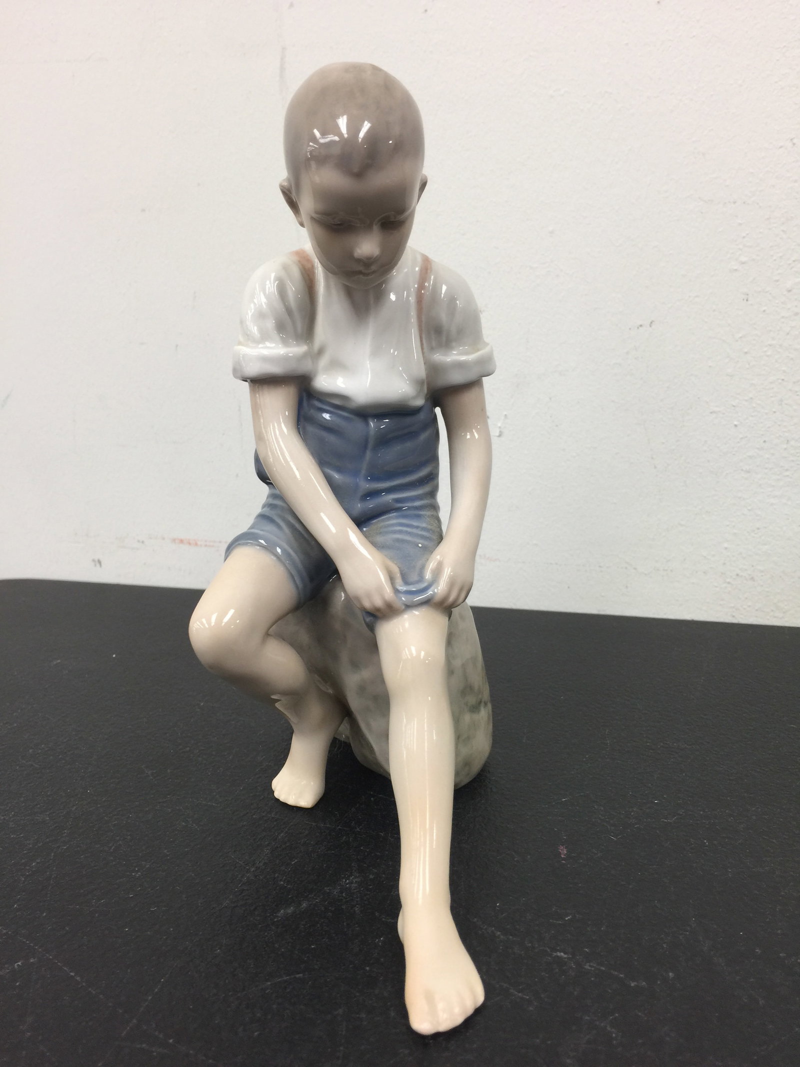 B&G 1757 Boy on Stone Figurine: MArked on base 8" H.