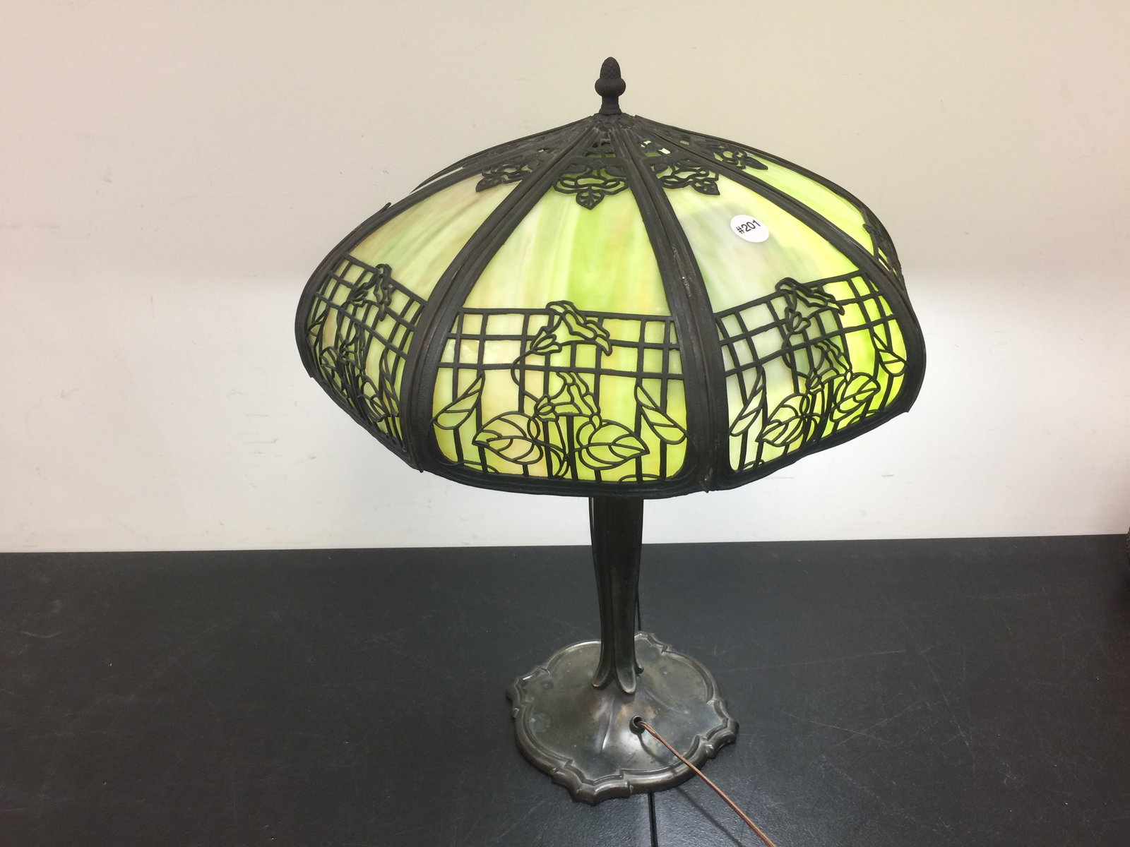 Antique Slag Glass Lamp: Six panels, has a floral design on shade. 23" H.