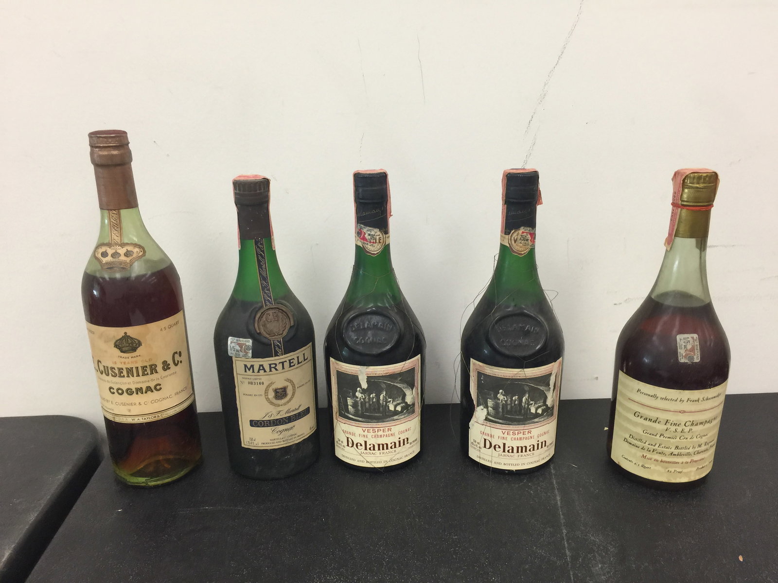 Estate Liqueur Cognac Bottles (5): unopened, lot cant be shipped. incldues delamain, cusenier & co and grande fine champagne.